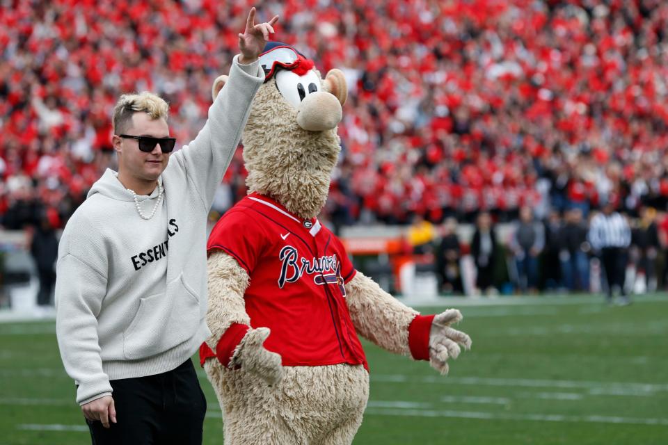 Atlanta Braves World Series Champion Joc Pederson and Braves mascot Blooper are honored during a time out during the first half of a NCAA college football game between Missouri and Georgia in Athens, Ga., on Saturday, Nov. 6, 2021. Georgia won 43-6.