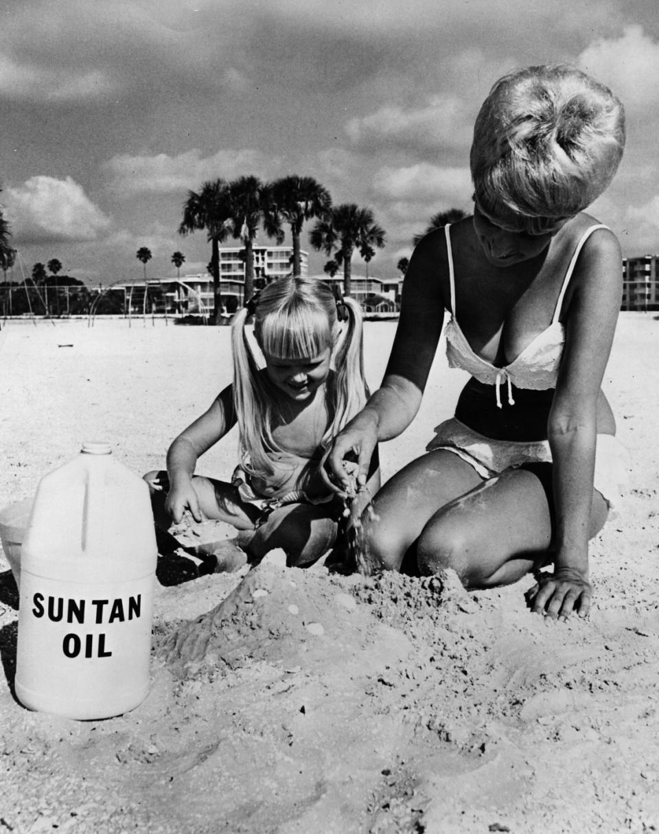 <p>The sandcastle is cool and all, but apparently people used to carry around <em>a literal jug</em> of suntan oil. </p>