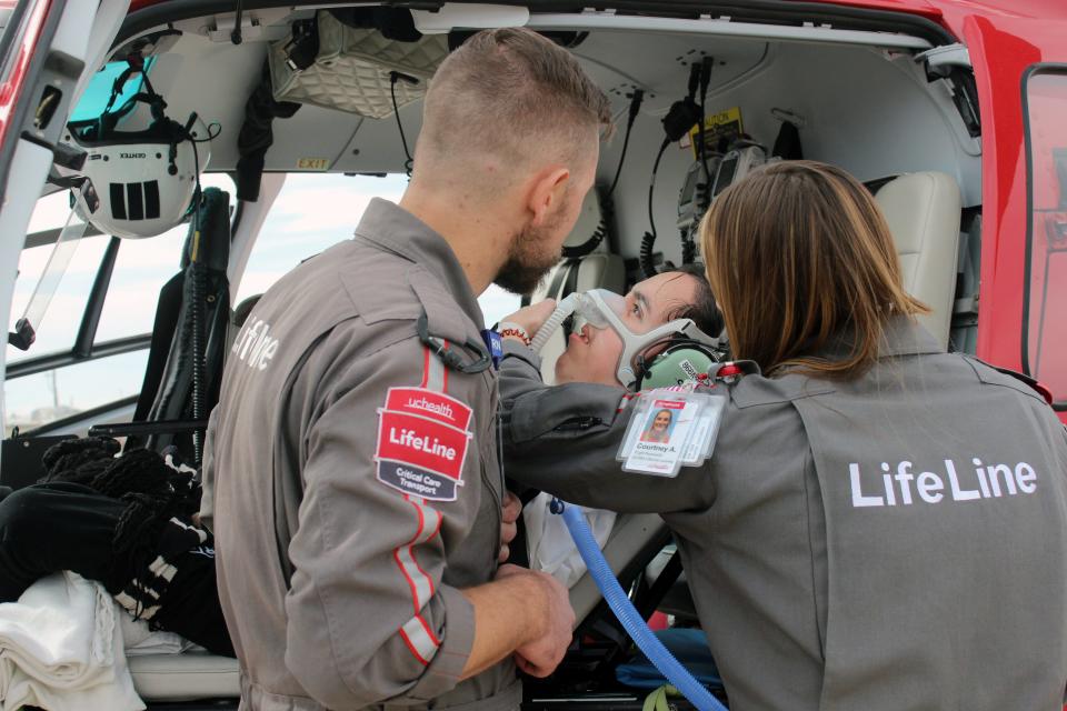 UCHealth LifeLine staff help Cesar Malagon get comfortable inside an airbus helicopter before takeoff Monday.