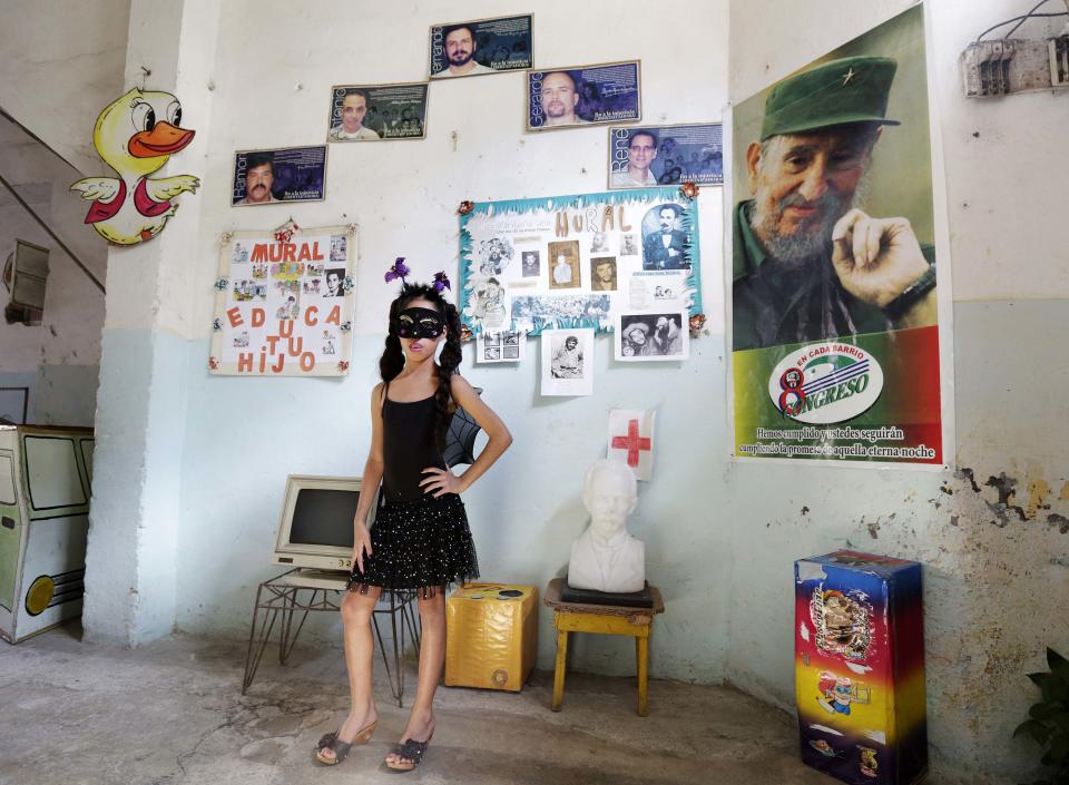 Third grade student at the Enrique Villuendas Primary School, Jeanne Silva, poses in her vampire costume in Havana