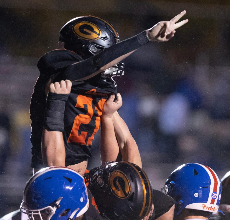 Green's Jorden Beyl is hoisted up to celebrate a second-half TD against Lake, Oct, 20, 2023.
