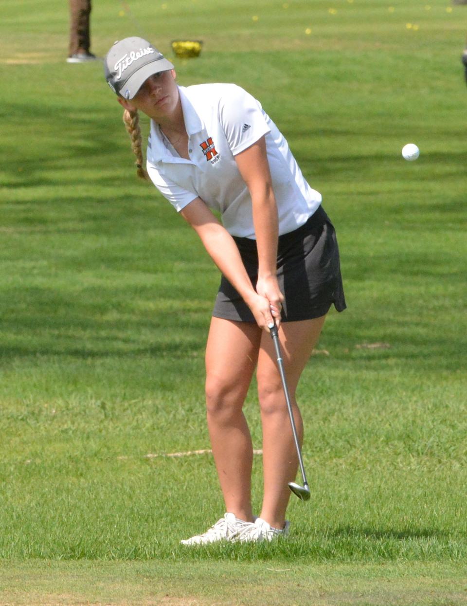 Huron's Bryn Huber chips on No. 8 Red during the 2022 Watertown Girls Golf Invitational at Cattail Crossing Golf Course.