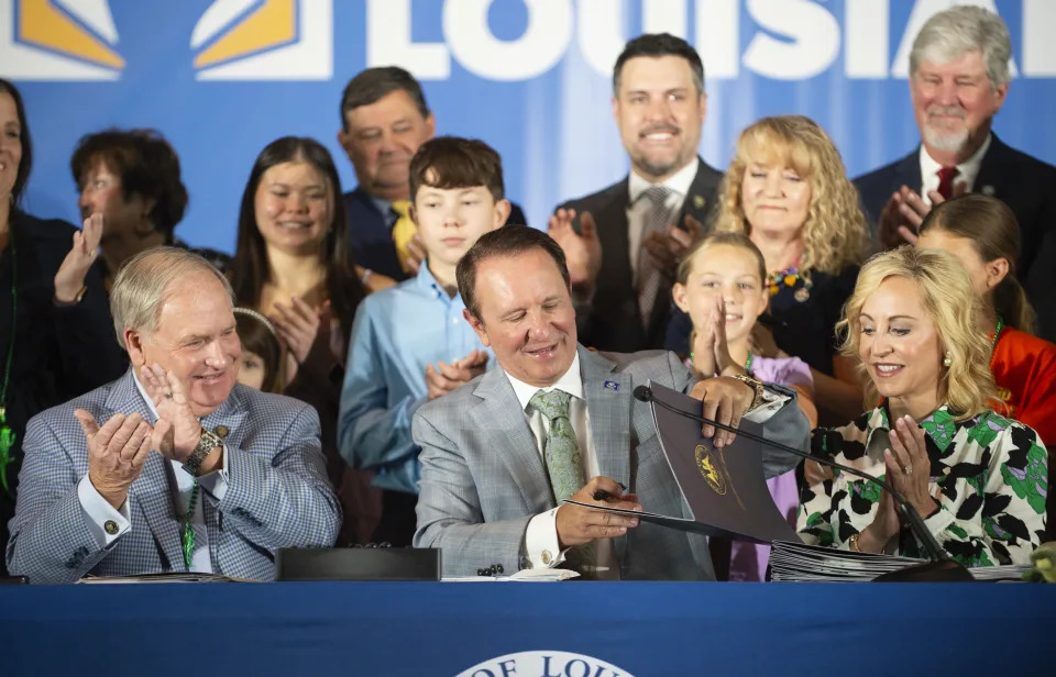 FILE - Louisiana Gov. Jeff Landry signs bills June 19, 2024, at Our Lady of Fatima Catholic School in Lafayette, La. A slew of legislation, including a first-of-its-kind law that allows judges to impose the punishment of surgical castration for offenders guilty of certain sex crimes against children, went into effect Thursday, Aug. 1. (Brad Bowie/The Times-Picayune/The New Orleans Advocate via AP, File)