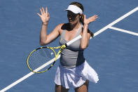 Danielle Collins of the U.S. bounces the racket in frustration during her quarterfinal match against Alize Cornet of France at the Australian Open tennis championships in Melbourne, Australia, Wednesday, Jan. 26, 2022. (AP Photo/Andy Brownbill)