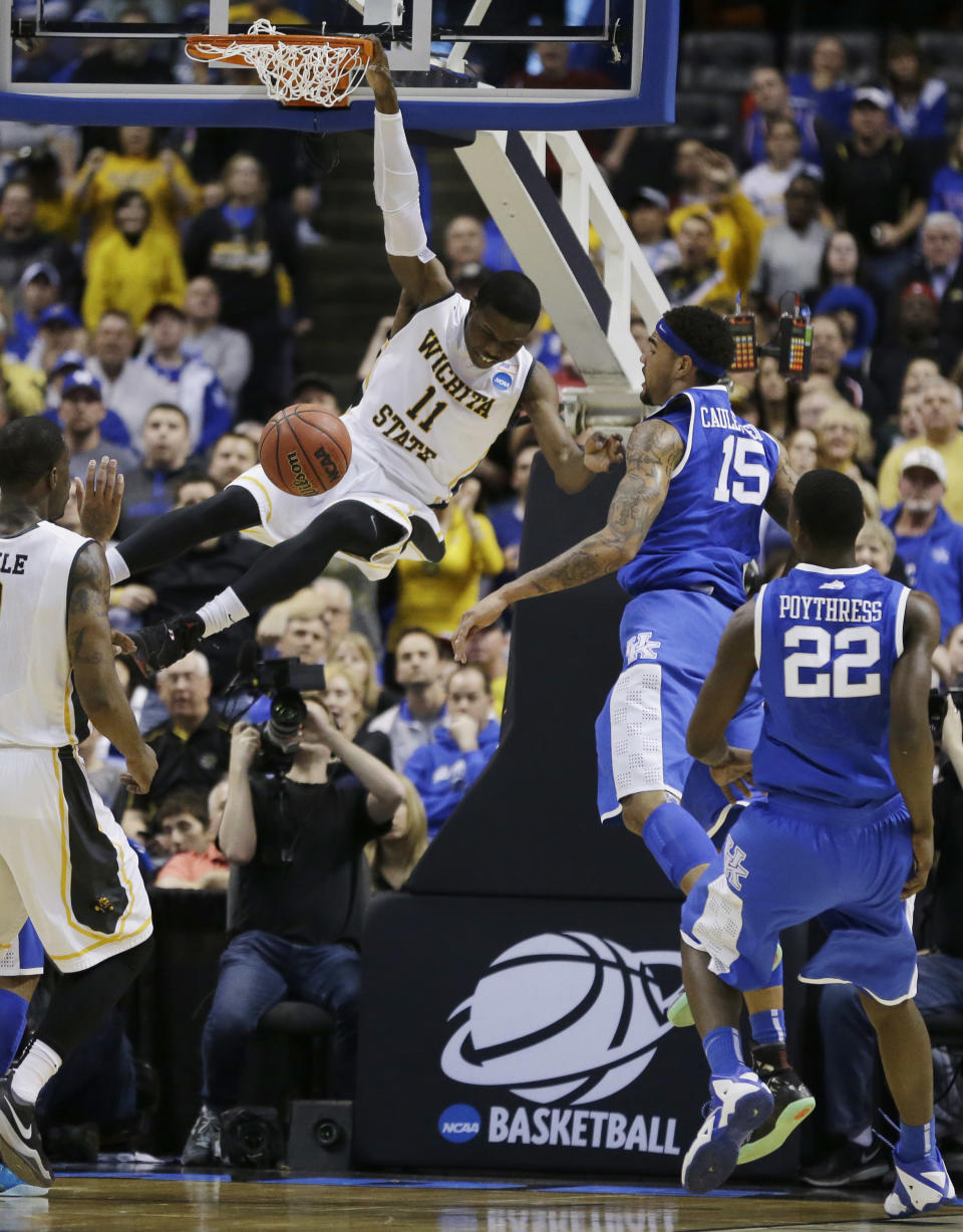 Wichita State forward Cleanthony Early (11) dunks against Kentucky during the first half of a third-round game of the NCAA college basketball tournament Sunday, March 23, 2014, in St. Louis. (AP Photo/Jeff Roberson)