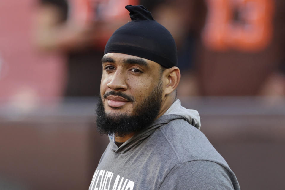 FILE - In this Aug. 29, 2019, file photo, Cleveland Browns outside linebacker Olivier Vernon is shown before an NFL preseason football game against the Detroit Lions in Cleveland. The Browns have reconstructed defensive end Olivier Vernon's contract for next season, a person familiar with the negotiations told the Associated Press on Tuesday, July 7, 2020. Vernon's future with the Browns seemed uncertain as he was set to make $15.25 million in 2020. But the club reworked his deal and he'll earn $11 million, said the person who spoke on condition of anonymity because the team is not publicly disclosing the agreement.(AP Photo/Ron Schwane, File)