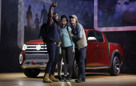 Models take a selfie as the 2019 Volkswagen Atlas pickup truck is presented at the New York Auto Show in the Manhattan borough of New York City, New York, U.S., March 28, 2018. REUTERS/Shannon Stapleton