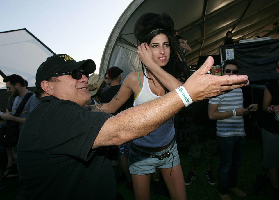INDIO, CA - APRIL 27:  Actor Danny DeVito (L) and singer Amy Winehouse attend day 1 of the Coachella Music Festival held at the Empire Polo Field on April 27, 2007 in Indio, California.  (Photo by Michael Buckner/Getty Images)