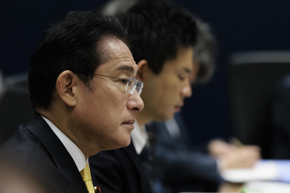 Japan's Prime Minister Fumio Kishida listens to Australian Prime Minister Anthony Albanese, not in photo, in Perth, Australia, Saturday, Oct. 22, 2022. Kishida is on a visit to bolster military and energy cooperation between Australia and Japan amid their shared concerns about China. (Richard Wainwright/Pool Photo via AP)