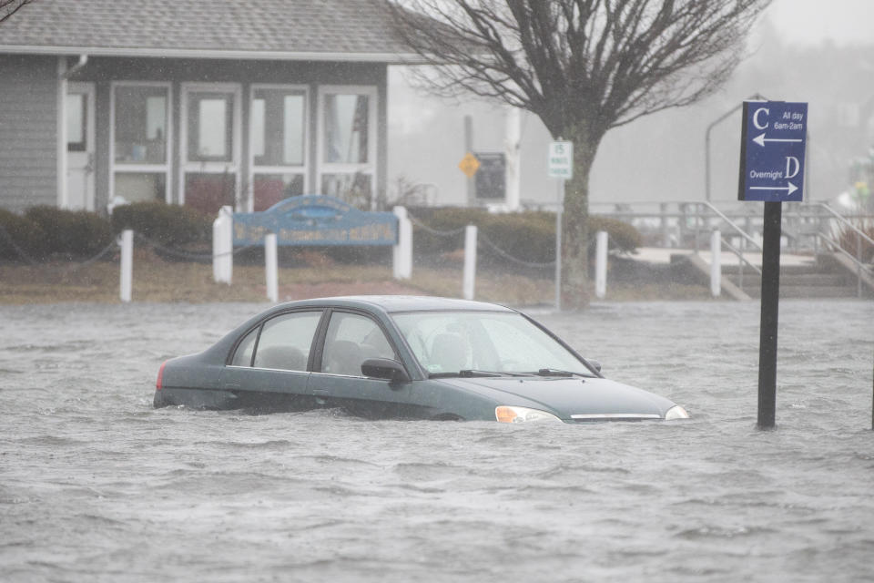 <p>A flooded car parked in a lot behind Front St. as a large coastal storm affects the area on March 2, 2018 in Scituate, Mass. (Photo: Scott Eisen/Getty Images) </p>