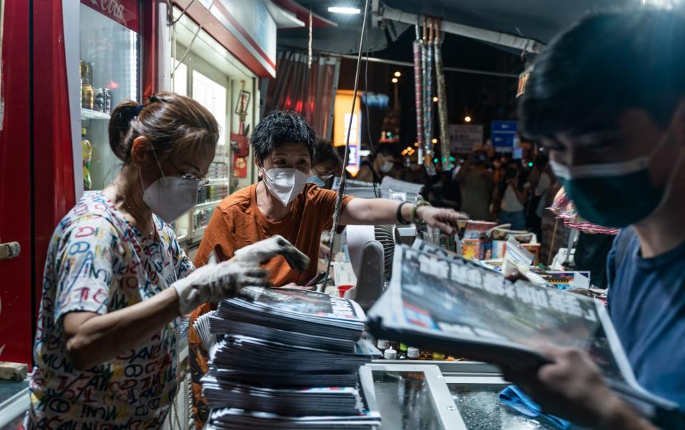 Hongkongers queued up in the early hours to get a copy - GETTY IMAGES