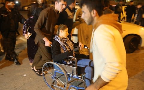 A woman with a wheel chair is seen at Sulaymaniyah Hospital after a 7.2 magnitude earthquake hit northern Iraq in Sulaymaniyah, Iraq on November 12, 2017.  - Credit:  Anadolu