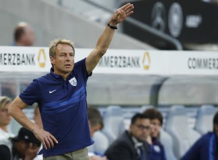 U.S. national soccer team coach Juergen Klinsmann gestures during their international friendly soccer match against Germany in Cologne, Germany June 10, 2015. REUTERS/Ina Fassbender