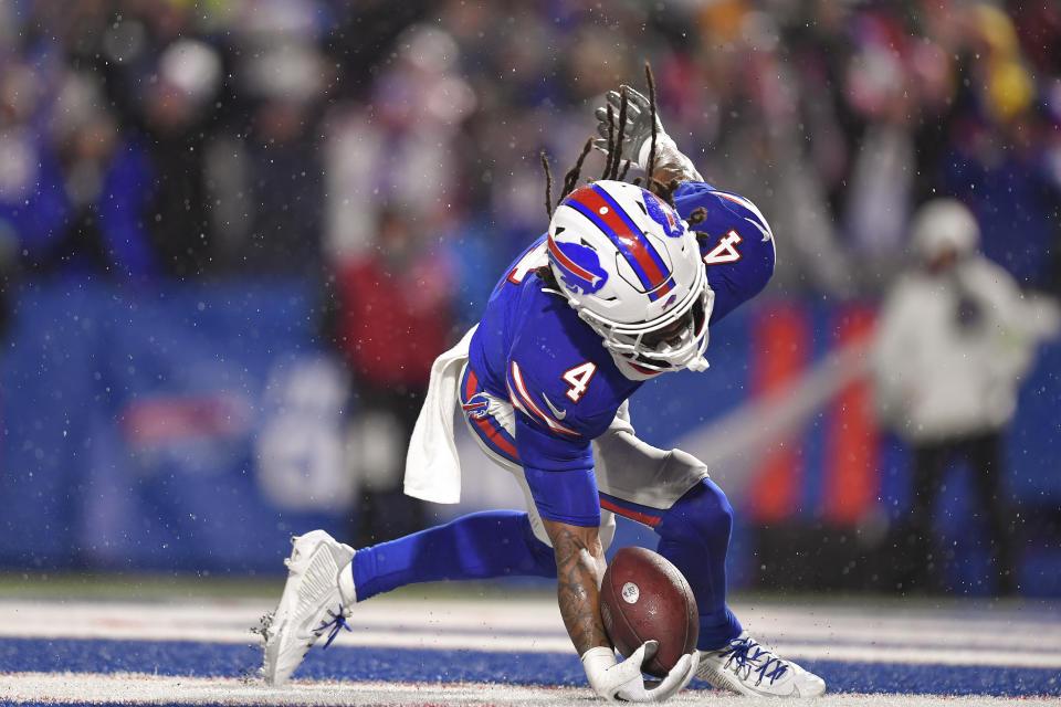 Buffalo Bills running back James Cook (4) scores a touchdown against the Dallas Cowboys during the fourth quarter of an NFL football game, Sunday, Dec. 17, 2023, in Orchard Park, N.Y. (AP Photo/Adrian Kraus)