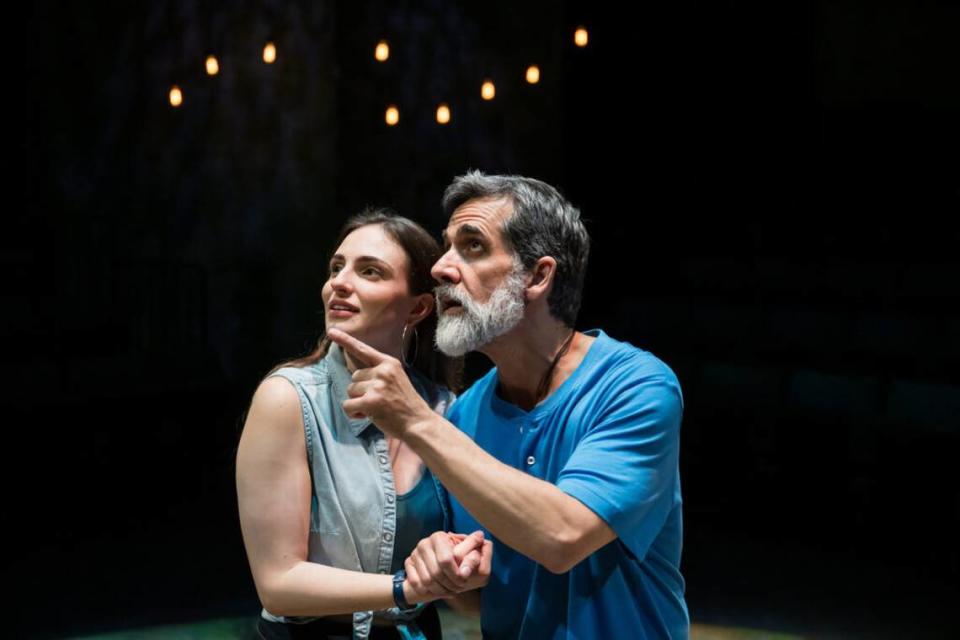 From left, Emily Garcia Carrerou as María Elena García watches as Carlos Orizondo’s Tío Manolo revels in the beauty of Puerto Rico in “La Gringa” at the Arsht Center.