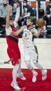 Indiana Pacers forward Domantas Sabonis, right, passes the ball away from Portland Trail Blazers center Jusuf Nurkic during the first half of an NBA basketball game in Portland, Ore., Thursday, Jan. 14, 2021. (AP Photo/Craig Mitchelldyer)