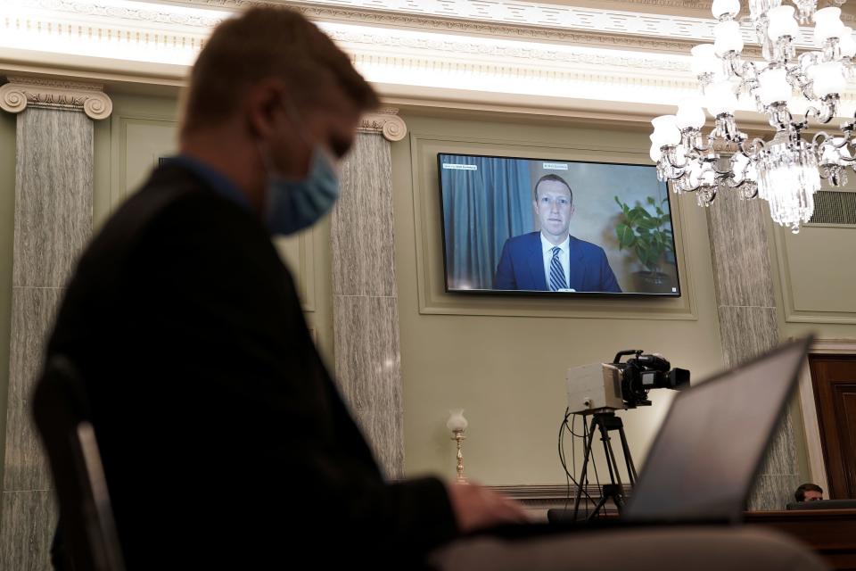 Facebook CEO Mark Zuckerberg appears on a screen as he speaks remotely during a hearing before the Senate Commerce Committee on Capitol Hill on Oct. 28, 2020, in Washington. The committee summoned the CEOs of Twitter, Facebook and Google to testify during the hearing.