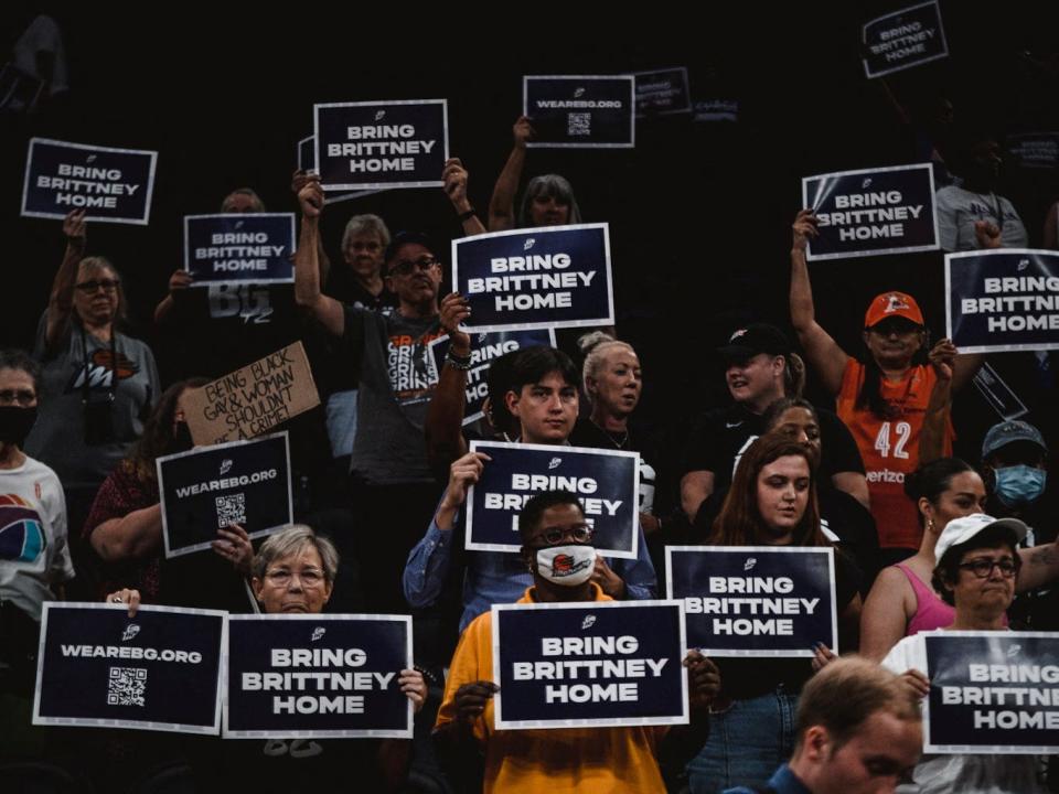 Fans hold signs to support Brittney Griner.