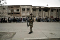 <p>Iraqis wait in a long line to cast their votes in the country’s parliamentary elections at a polling site in a damaged building in west Mosul, Iraq, Saturday, May 12, 2018. This is the first parliamentary election since the militant group was ousted from the city. (Photo: Maya Alleruzzo/AP) </p>