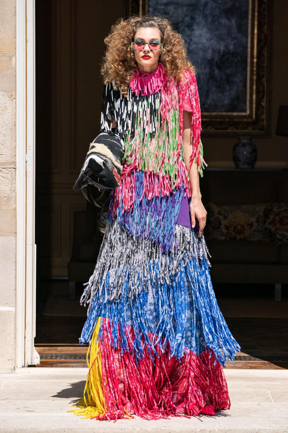 Ronald van der Kemp’s couture collections are made from nearly 100 percent upcycled or reconstructed materials, including this dress, which was painstakingly handmade. “Each piece of fringe was cut on the bias, turned inside out, and sewn into a tube,” he told Vogue’s Nicole Phelps. “I love it because it’s real couture.”