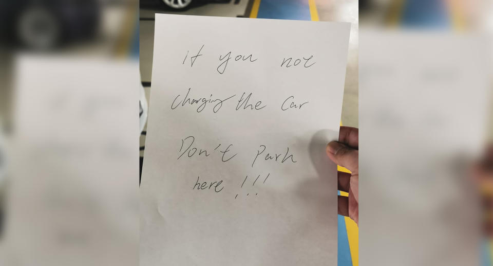 A note that reads: If you not charging the car, don't park here!!