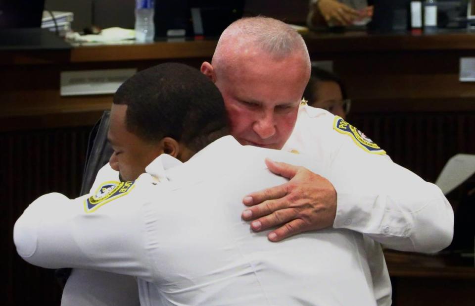 Newly appointed Columbus Police Chief Stoney Mathis, facing camera, embraces Columbus Police Lt. Alan Malone after Mathis was confirmed as the new chief by a unanimous vote by Columbus Councilors on Tuesday morning. 10/10/2023