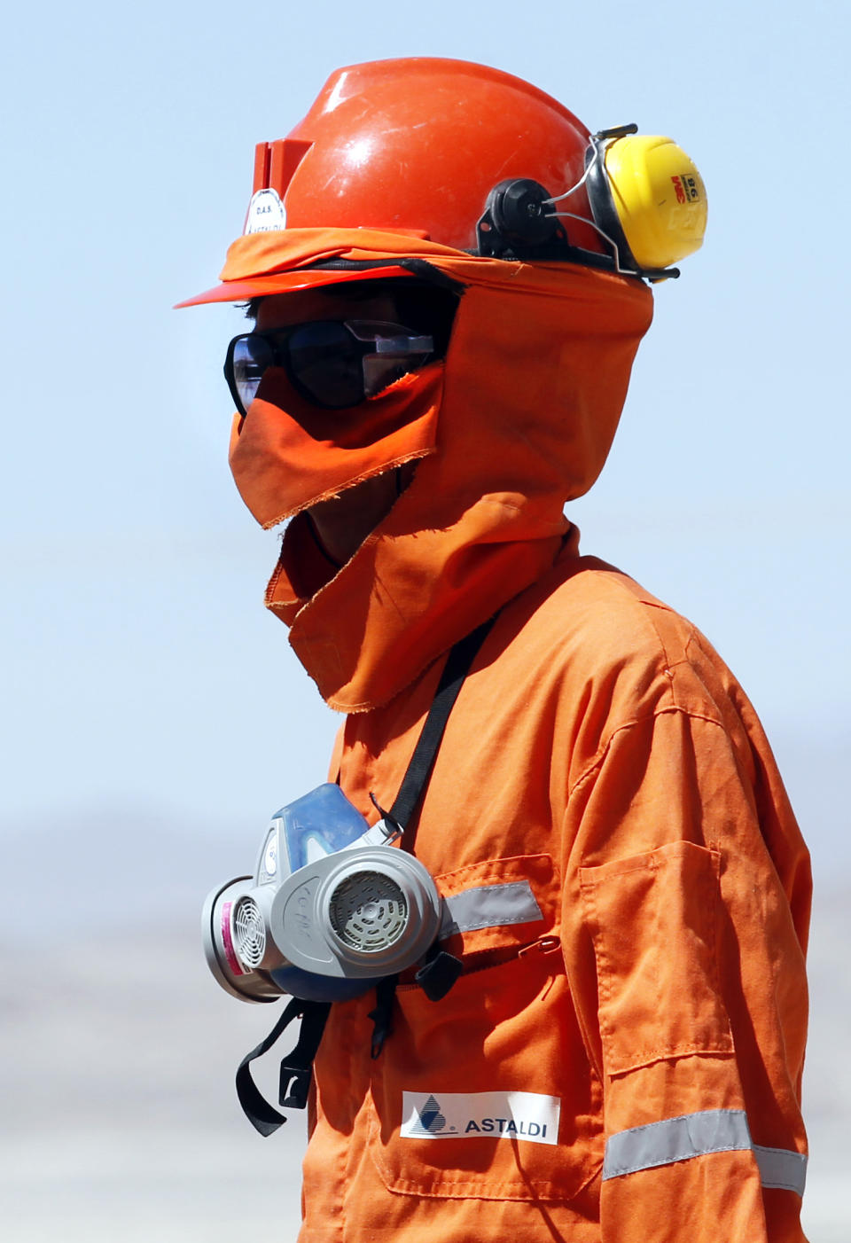 In this Sept. 25, 2012 photo, Jairo Bautista, who works for Astaldi, an Italian company which works with the Chilean National Cooper Corporation, or Codelco, looks toward the entrance of a drilled tunnel at the Chuquicamata copper mine in the Atacama desert in northern Chile. Experts say that by 2019 the Chuquicamata copper mine will be unprofitable, so state-owned mining company Codelco is trying to head off closure by converting the open pit into the world's largest underground mine. Codelco believes the mine still has much more to give, with reserves equal to about 60 percent of all the copper exploited in the mine's history still buried deep beneath the crater. (AP Photo/Jorge Saenz)