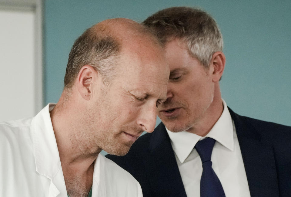 Surgeon Sergio Alfieri, left, listens to pope's spokeperson Matteo Bruni during a media briefing Saturday, June 10, 2023, about Pope Francis' health conditions after his operation at Rome's Agostino Gemelli University Polyclinic, on Wednesday. Pope Francis, who underwent surgery Wednesday to repair a hernia in his abdominal wall, is following a careful convalescence which aims at reducing the effort of the abdominal wall, to allow the implanted prosthetic mesh and the repair of the muscular fascia to heal optimally. (AP Photo/Alessandra Tarantino)