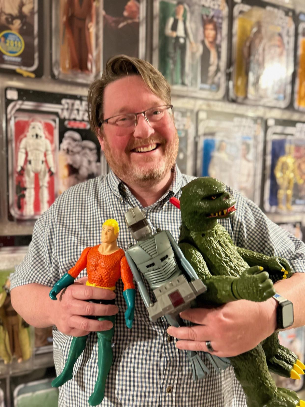 Norwalk resident Daniel Pickett is a toy and action figure expert. He appears on the third season of "The Toys That Built America" on the History Channel. Here he holds Aquaman, Rom the Space Knight, and Godzilla.