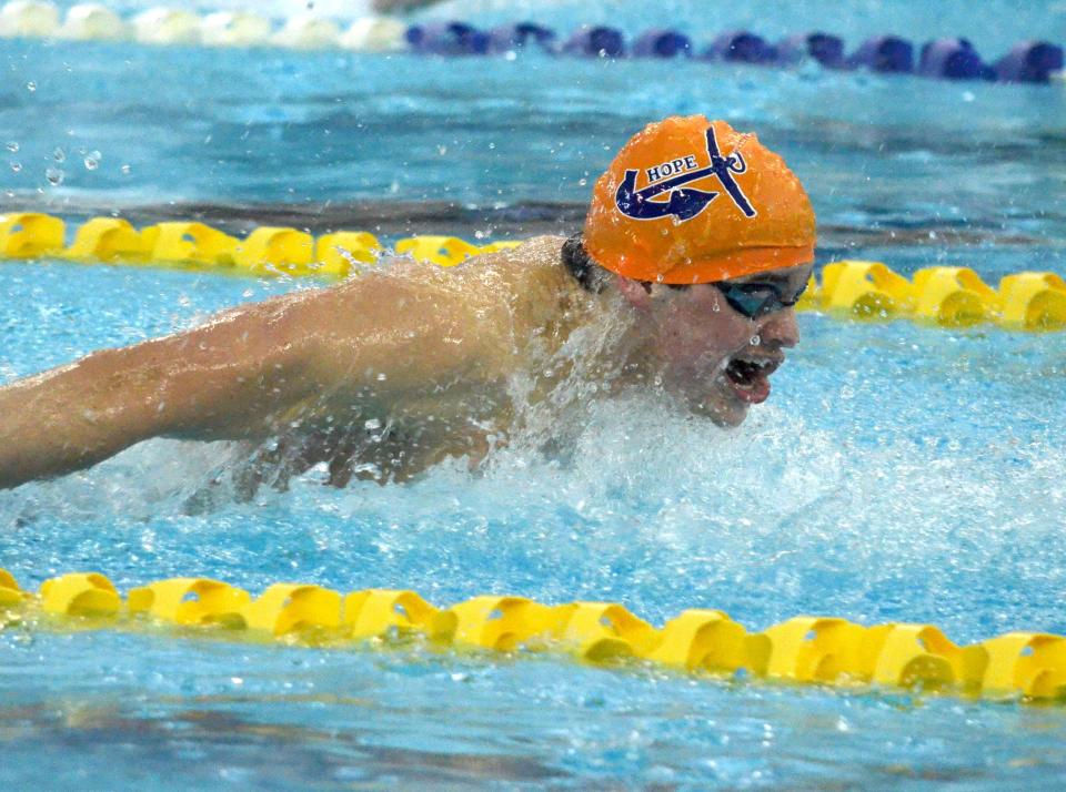 Hope College's Ben Catton swims the 100 butterfly on Day 3 of the MIAA Swimming and Diving Championships at Holland Community Aquatic Center.