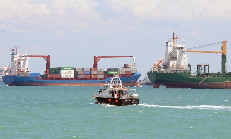 A Singapore police coast guard boat in the Singapore Strait. Two ships collided near Sisters Island early Wednesday morning. (Photo: AFP)