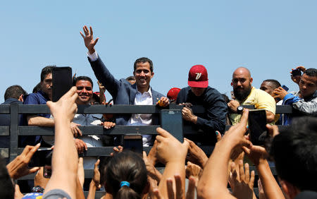 Venezuelan opposition leader Juan Guaido, who many nations have recognised as the country's rightful interim ruler, takes part in a rally against Venezuelan President Nicolas Maduro's government, in Guacara, Venezuela March 16, 2019. REUTERS/Carlos Jasso