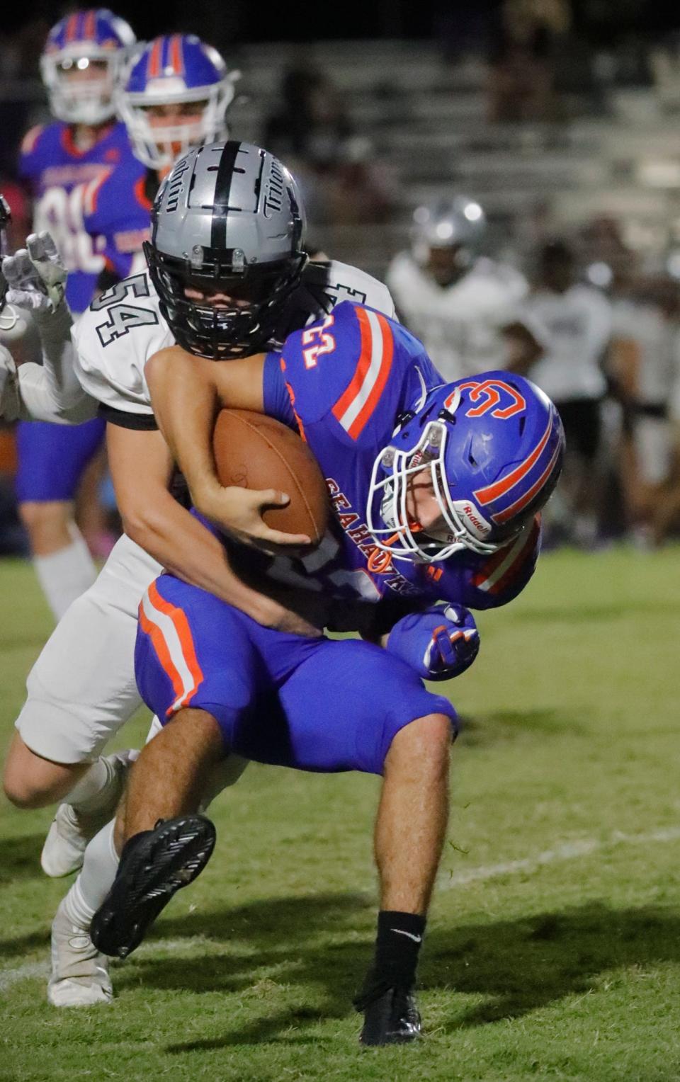 Defensive player Karson Long tackles rusher Damien Miranda during their matchup.The Mariner Tritons visited the Cape Coral High School Seahawks Thursday, October 27, 2022 in a rivalry matchup.