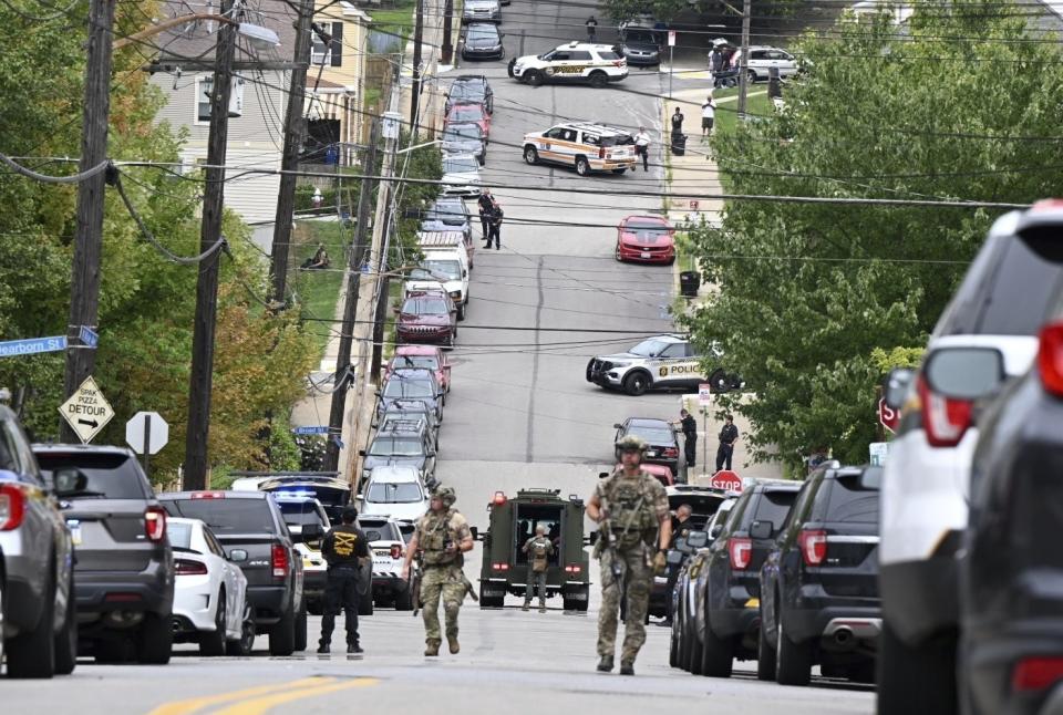 Pittsburgh police and other law enforcement personnel respond to gunfire in the Garfield neighborhood of Pittsburgh on Wednesday, Aug. 23, 2023. (Lucy Schaly/Pittsburgh Post-Gazette via AP)