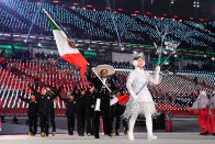 <p>Flag bearer German Madrazo of Mexico leads his country wearing a traditional sombrero and embroidered blazer and trousers while the team wears traditional all-black winter clothes during the opening ceremony of the 2018 PyeongChang Games. (Photo: Quinn Rooney/Getty Images) </p>