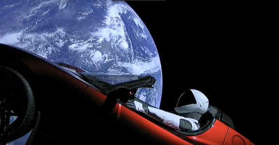 A screenshot of the "Starman" mannequin in the Telsa Roadster orbiting Earth.