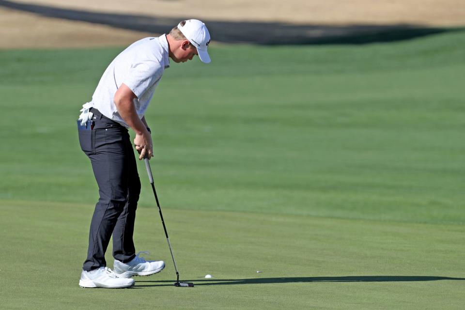 Caleb Surratt sinks a putt on the 10th green on the Nicklaus Tournament Course during the first-round of The American Express in La Quinta, Calif., on Thursday, Jan. 19, 2023. 