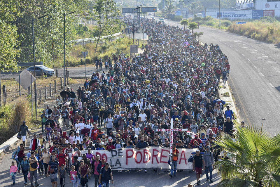 FILE - Migrants depart from Tapachula, Mexico, Dec. 24, 2023. Former President Donald Trump is seizing on his party's frustration with the recent surge of illegal crossings at the southern U.S. border to churn up fears around voter fraud. Ahead of Iowa's caucuses next week, the former Republican president has repeatedly suggested that Democrats are planning to sign unauthorized migrants up to vote in 2024. (AP Photo/Edgar H. Clemente, File)