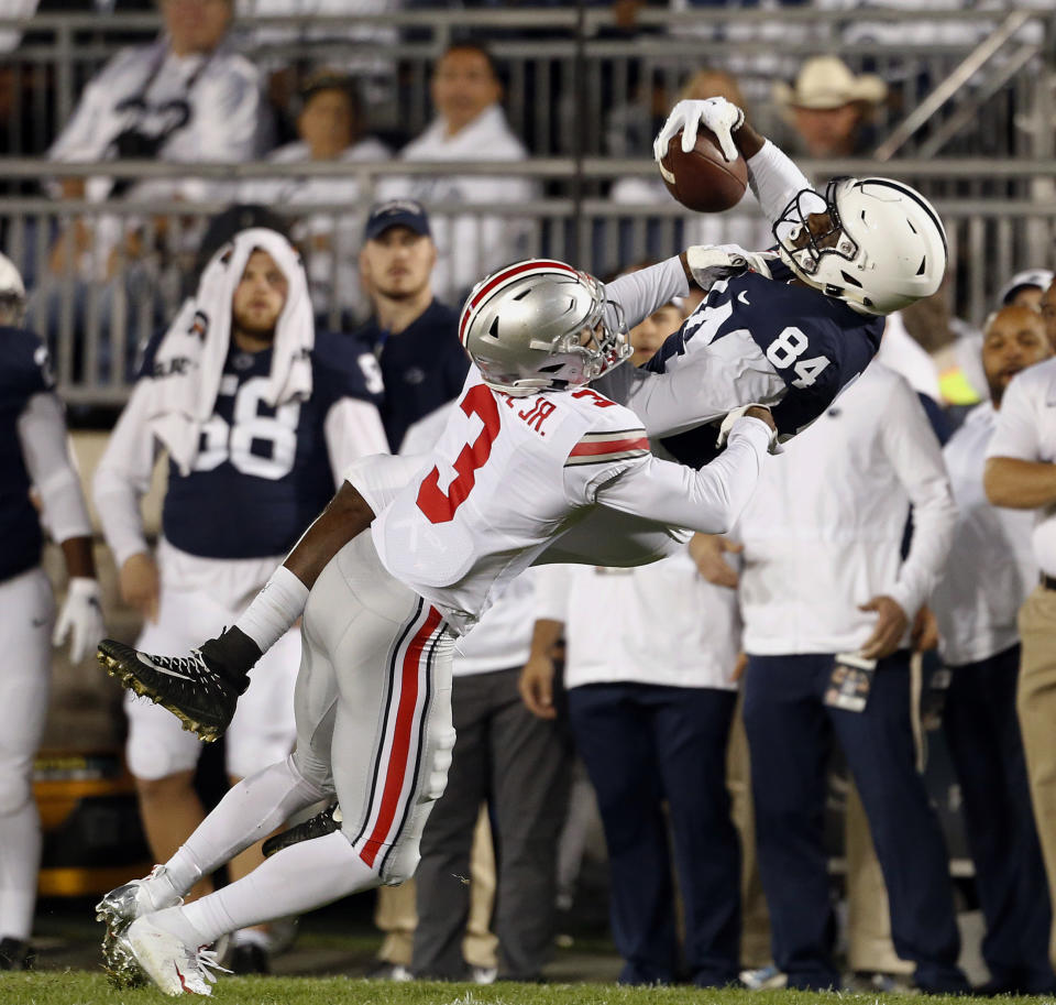 Penn State's Juwan Johnson (84) makes a catch as Ohio State's Damon Arnette (3) defends during the first half of an NCAA college football game in State College, Pa., Saturday, Sept. 29, 2018. (AP Photo/Chris Knight)