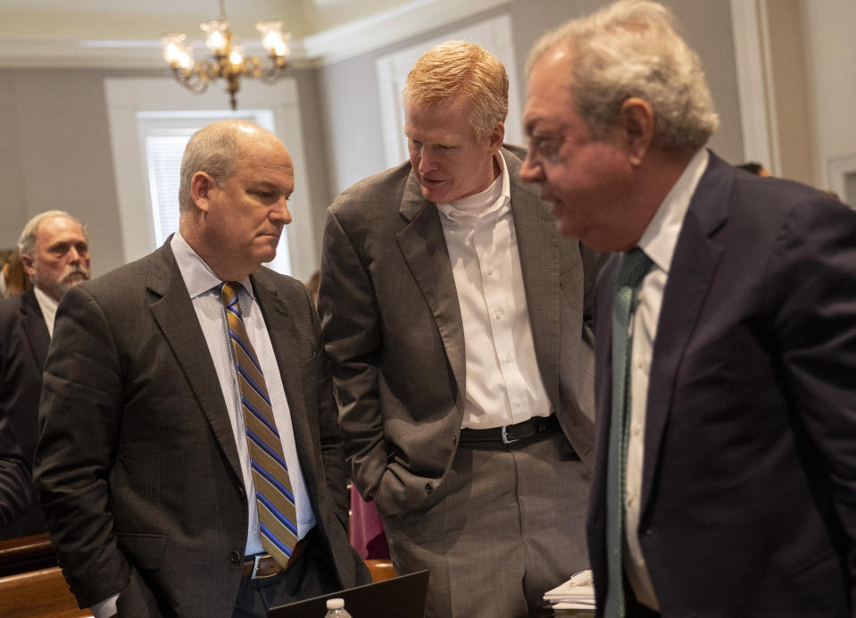 Defense attorney Jim Griffin, left, Alex Murdaugh, center, and Dick Harpootlian talk on a break during Murdaugh's double murder trial at the Colleton County Courthouse in Walterboro, S.C., Wednesday, Feb. 1, 2023. (Andrew J. Whitaker/The Post And Courier via AP, Pool)