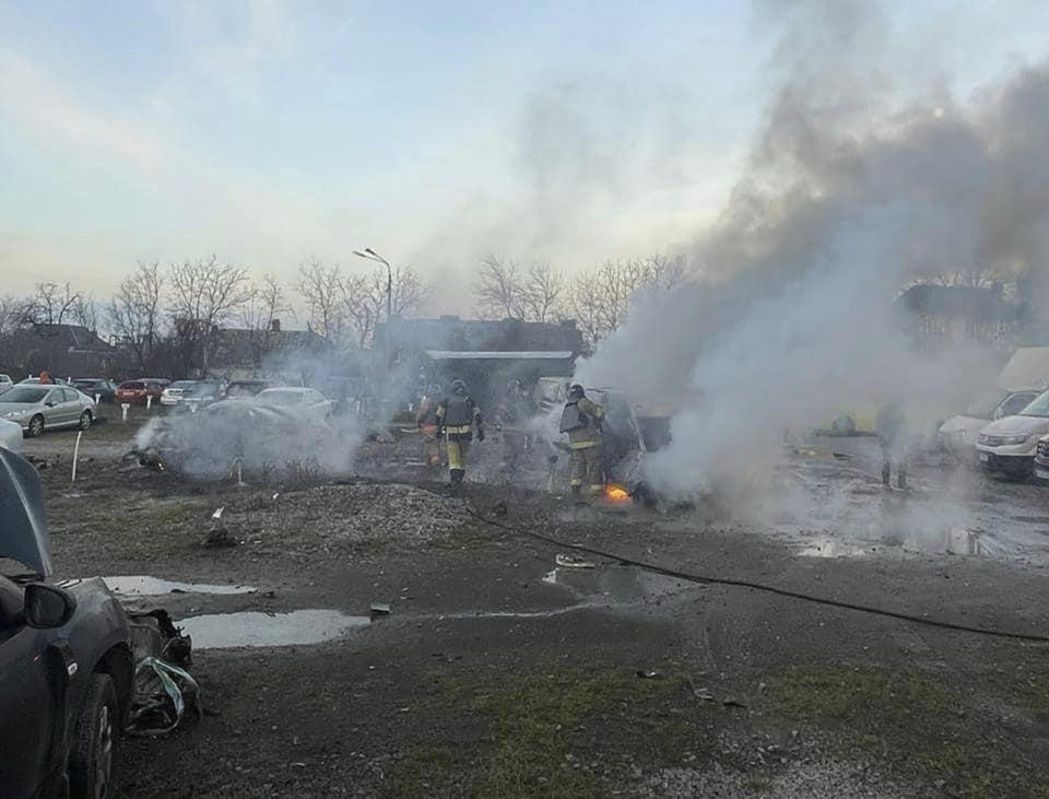 In this photo provided by the Ukrainian Emergency Service, firefighters work to extinguish a fire after a Russian attack in Kyiv, Ukraine, Friday, Dec. 29, 2023. (Ukrainian Emergency Service via AP)