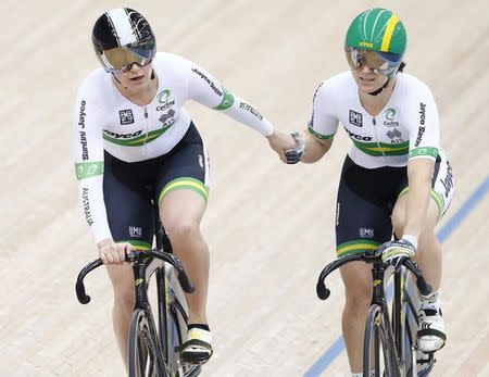 UCI World Track Cycling Championships - London, Britain - 6/3/2016 - Stephanie Morton (L) of Australia congratulates compatriot Anna Meares after she defeated her to qualify for the women's sprint semi-fianls. REUTERS/Andrew Winning