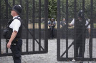 Armed police outside the Houses of Parliament in London, the day after a suspected terror attack, Wednesday Aug. 15, 2018. British counter-terrorism police are carrying out investigations after a car slammed into barriers outside the Houses of Parliament in London on Tuesday.(Stefan Rousseau/PA via AP)