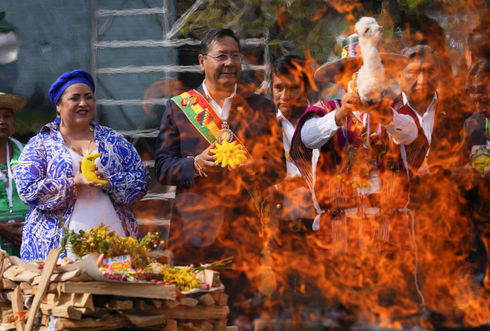 FILE - Bolivia's President Luis Arce, center, attends a ritual in honor of "Pachamama," or Mother Earth, to mark Arce's third year of government, in La Paz, Bolivia, Nov. 8, 2023. Arce had been ex-President Evo Morales' finance minister who oversaw years of strong growth and low inflation, but assuming the presidency in 2020, he encountered a bleak economic reckoning from the coronavirus pandemic. (AP Photo/Juan Karita, File)