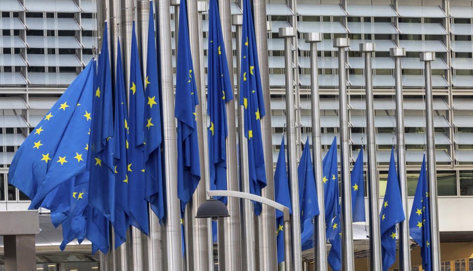 European Union flags flap in the wind at half-staff, in honour of European Parliament President David Sassoli, at EU headquarters in Brussels, Tuesday, Jan. 11, 2022. David Sassoli, the Italian journalist who worked his way up in politics and became president of the European Union's parliament, died at a hospital in Italy early Tuesday, Jan. 11, 2022 his spokesperson said. (AP Photo/Olivier Matthys)