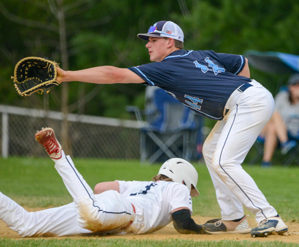 North Penn first baseman Ben Farley reaches for a throw during a game against Central Bucks East from earlier in the season.