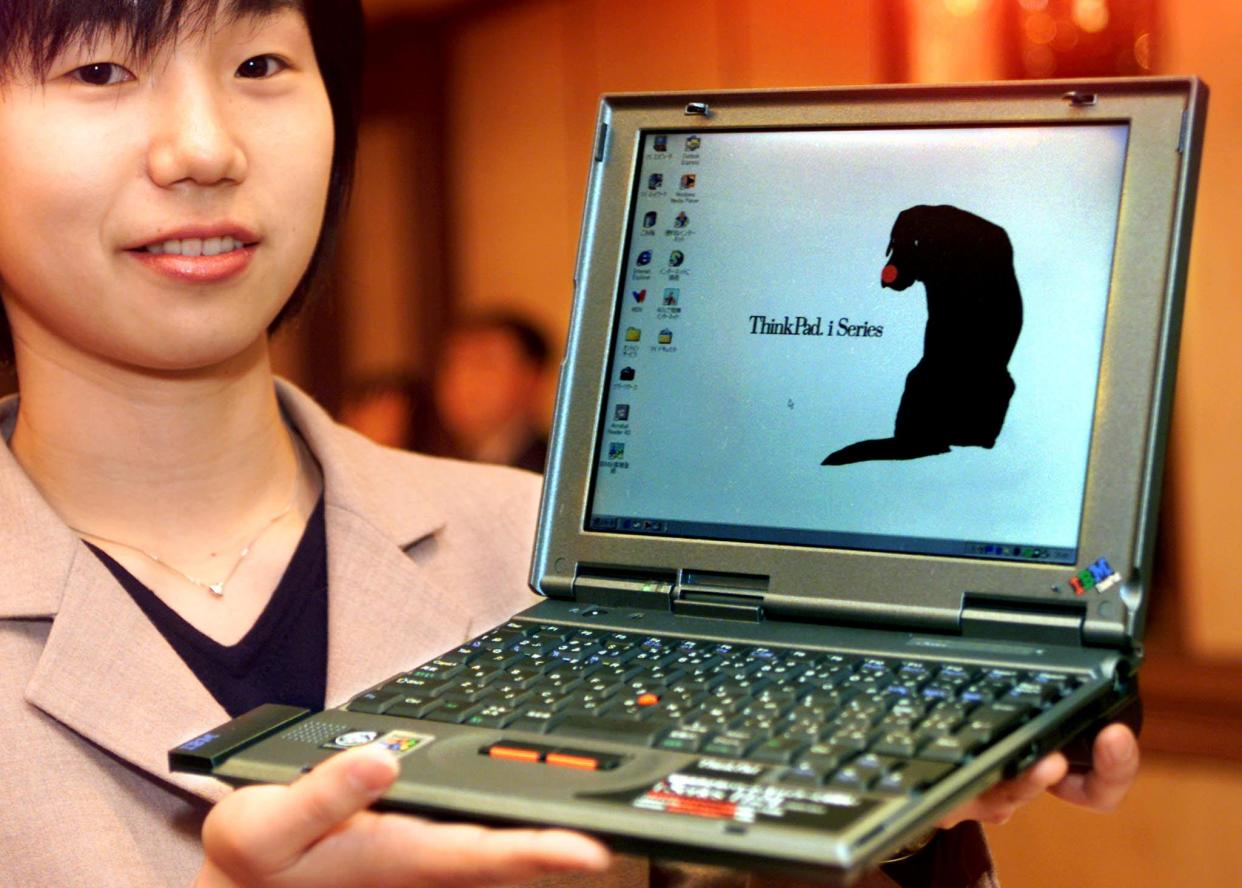 TOKYO, JAPAN:  Japan IBM employee Eri Iyama displays the new B5 sized notebook computer 