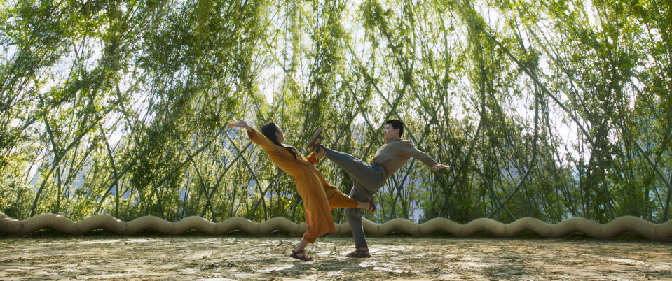 This image released by Marvel Studios shows Michelle Yeoh and Simu Liu, right, in a scene from "Shang-Chi and the Legend of the Ten Rings." (Marvel Studios via AP)