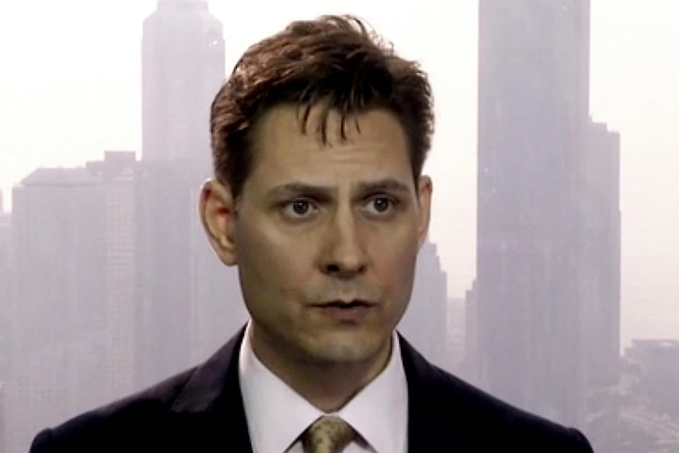 FILE - In this file image made from March 28, 2018, video, Michael Kovrig, an adviser with the International Crisis Group, a Brussels-based non-governmental organization, speaks during an interview in Hong Kong. China lashed out at Canada on Thursday, Feb. 18, 2021, for joining the U.S. and 56 other countries in endorsing a declaration denouncing state-sponsored arbitrary detention of foreign citizens for political purposes. The dispute is rooted in Canada’s campaign to free its nationals Kovrig and Michael Spavor, who were arrested more than two years ago by China in apparent retaliation for Canada's arrest days earlier of a top Chinese tech executive, Meng Wanzhou, who is wanted in the U.S. on fraud charges. (AP Photo, File)