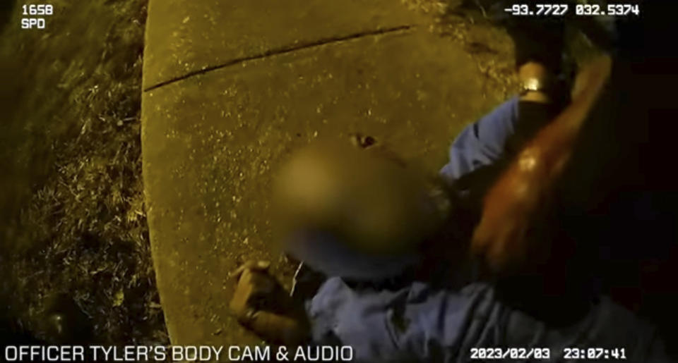 This photo provided by Louisiana State Police shows police body cam video of police administering aid to Alonzo Bagley after police shot Bagley after a foot chase on Feb. 3, 2023 in Shreveport, La. A white Louisiana police officer was arrested Thursday, Feb. 16, for fatally shooting Bagley, an unarmed Black man who was trying to flee police responding to a domestic disturbance. Shreveport Police Officer Alexander Tyler is charged with negligent homicide. (Louisiana State Police via AP)